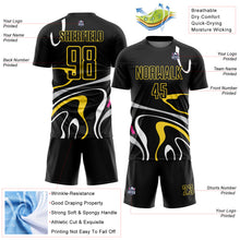 Charger l&#39;image dans la galerie, Custom Black Gold Fluid Shapes Sublimation Soccer Uniform Jersey
