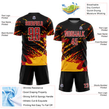 Load image into Gallery viewer, Custom Black Red-Gold Abstract Fragment Art Splash Sublimation Soccer Uniform Jersey
