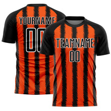 Laden Sie das Bild in den Galerie-Viewer, Custom Black Orange-White Line Sublimation Soccer Uniform Jersey
